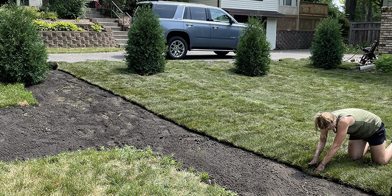 Sodding-Services-Signature-Lawns Signature Lawns installing new sod at a home